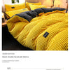 Yellow double-sided plush duvet cover for warmth retention shown on a bed.