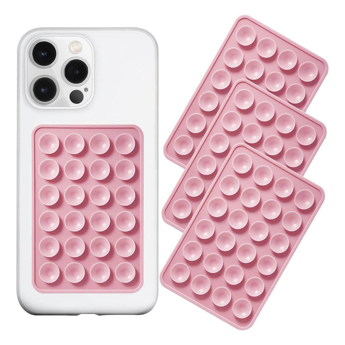 A white phone case and a pink silicone suction pad with multiple circular bumps for mounting devices.