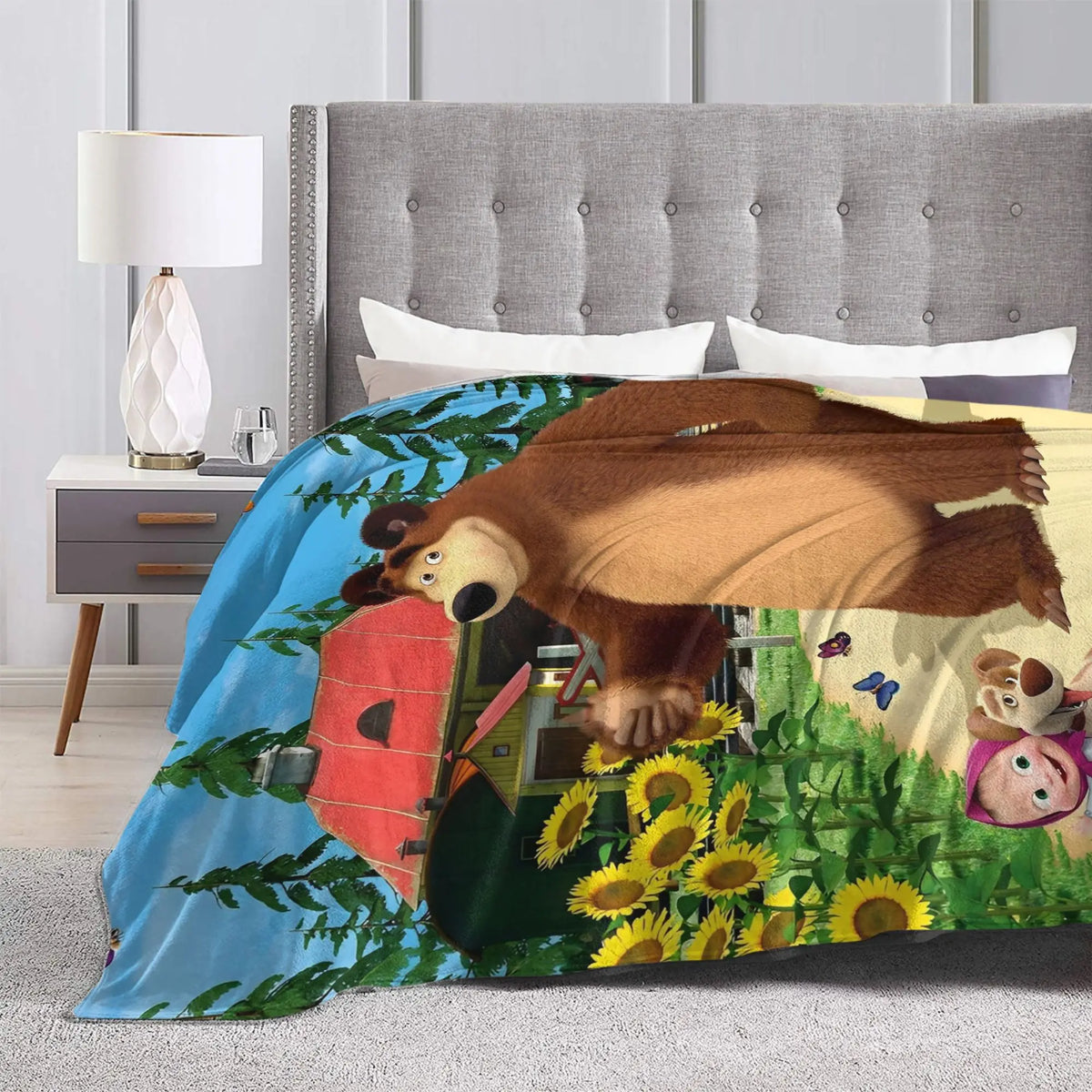 Flannel throw blanket featuring a cartoon design of Masha and Bear on a blue background.