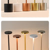 A row of five rechargeable LED table lamps with varying metallic finishes and white bases.