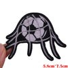 Black and white embroidered patch shaped like a hand with a soccer ball design