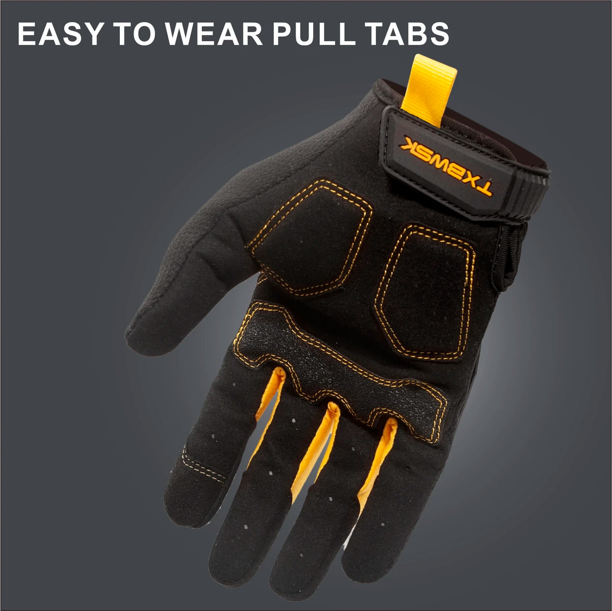 A close-up view of a black work glove with yellow pull tabs on the fingers and a black wrist strap.