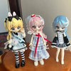 Three articulated BJD collectible figurines featuring pink, blonde, and blue hair in various outfits.
