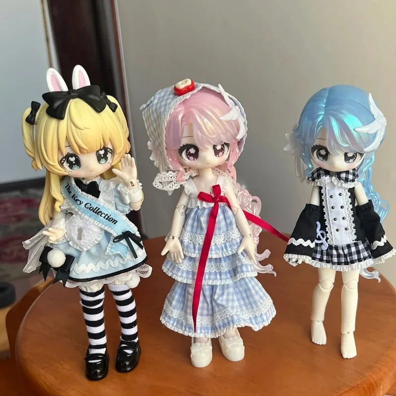 Three articulated BJD collectible figurines featuring pink, blonde, and blue hair in various outfits.