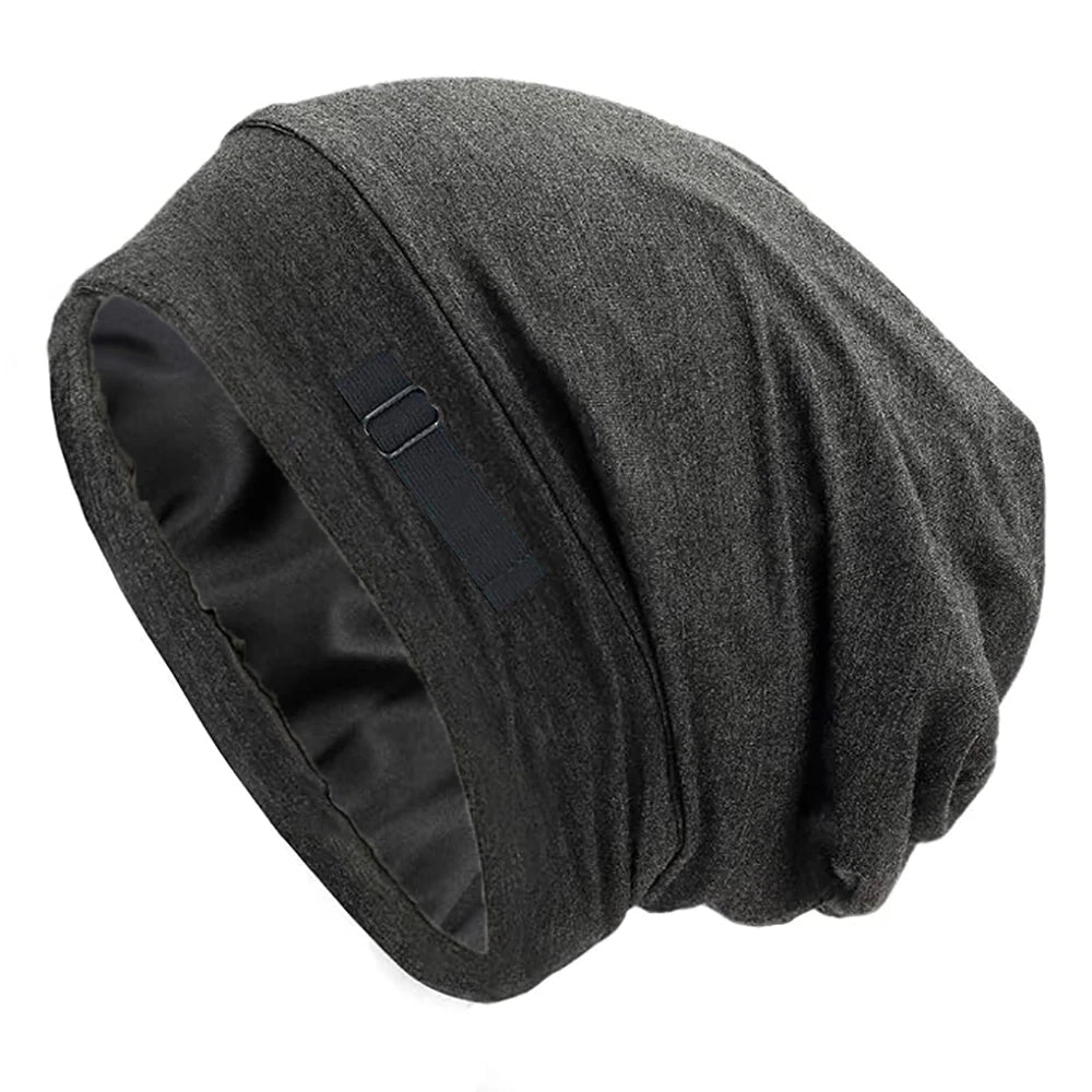 A dark gray silk-like night cap designed for long hair and curls.