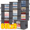 Nine dark gray foldable storage bags with transparent windows for storing textiles like quilts and blankets