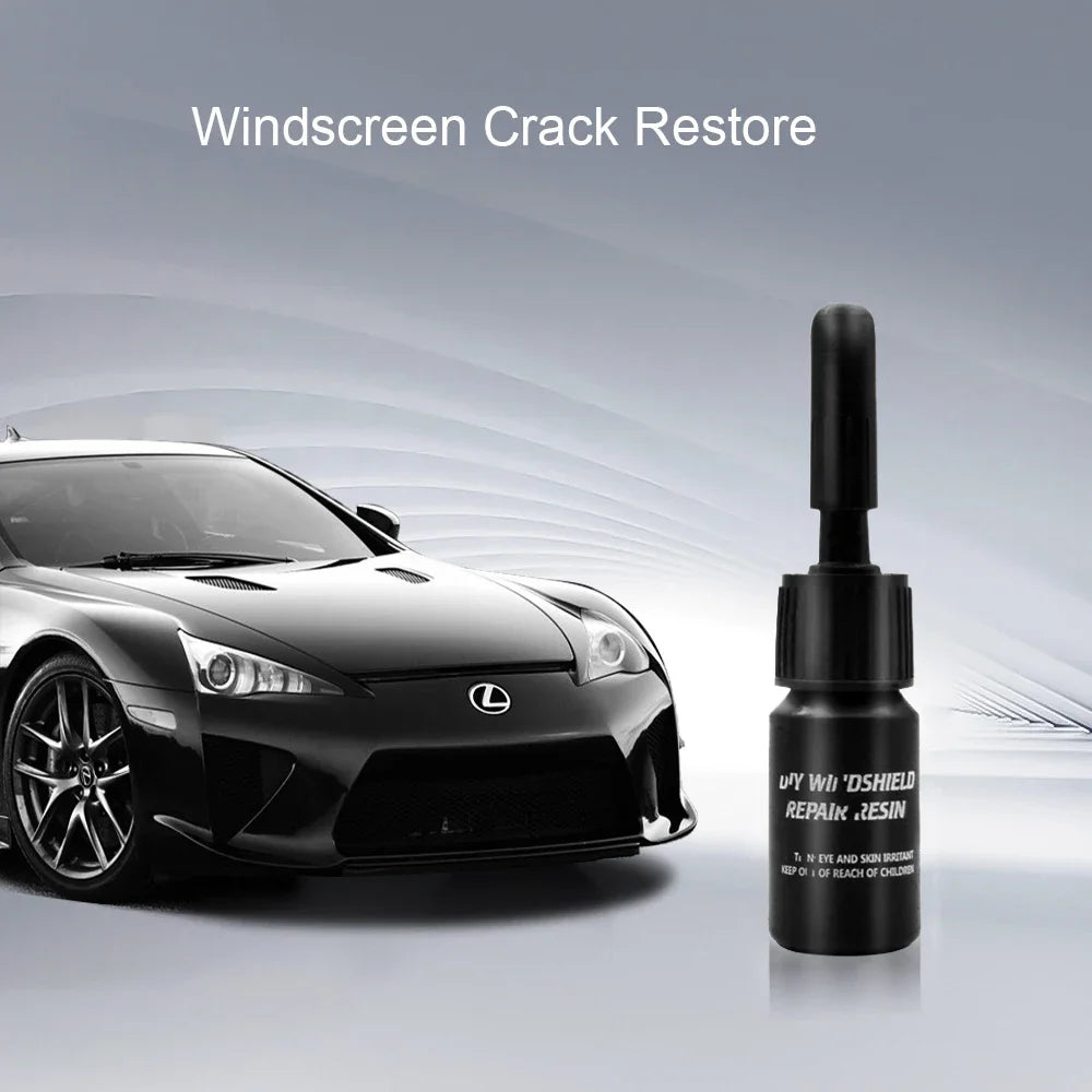 A bottle of windshield crack restore resin next to a black Lexus sports car.
