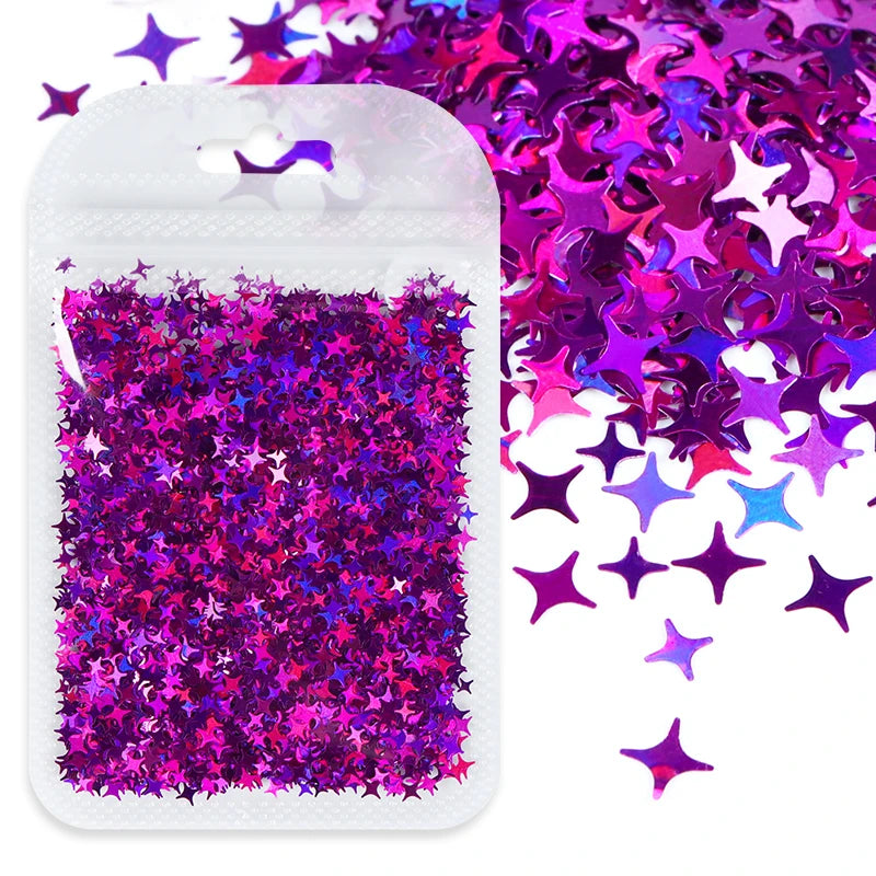 A white pouch filled with iridescent purple and pink holographic star sequins for resin crafts.