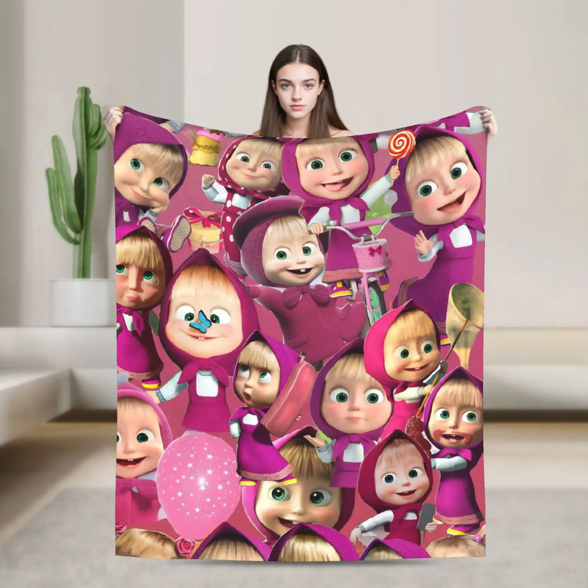 A flannel throw blanket featuring a cartoon design of Masha and Bear characters.