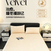 A white velvet fitted bed sheet with ribbed texture is displayed on a bed, emphasizing warmth and softness.