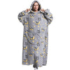 A woman wearing a gray hoodie blanket featuring a pattern of cute panda faces on a light background.