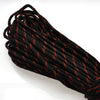 A coil of black paracord rope with orange accents, showing the twisted strands and texture.