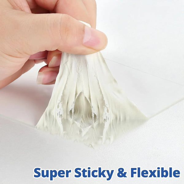 Hand holding a piece of white flexible rubber sealant tape for an RV roof.