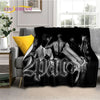 A black throw blanket featuring portraits of Eminem and 2Pac with a gun design.