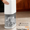 A white touchless trash can with a clear compartment showing dry ice and an airtight odor seal.