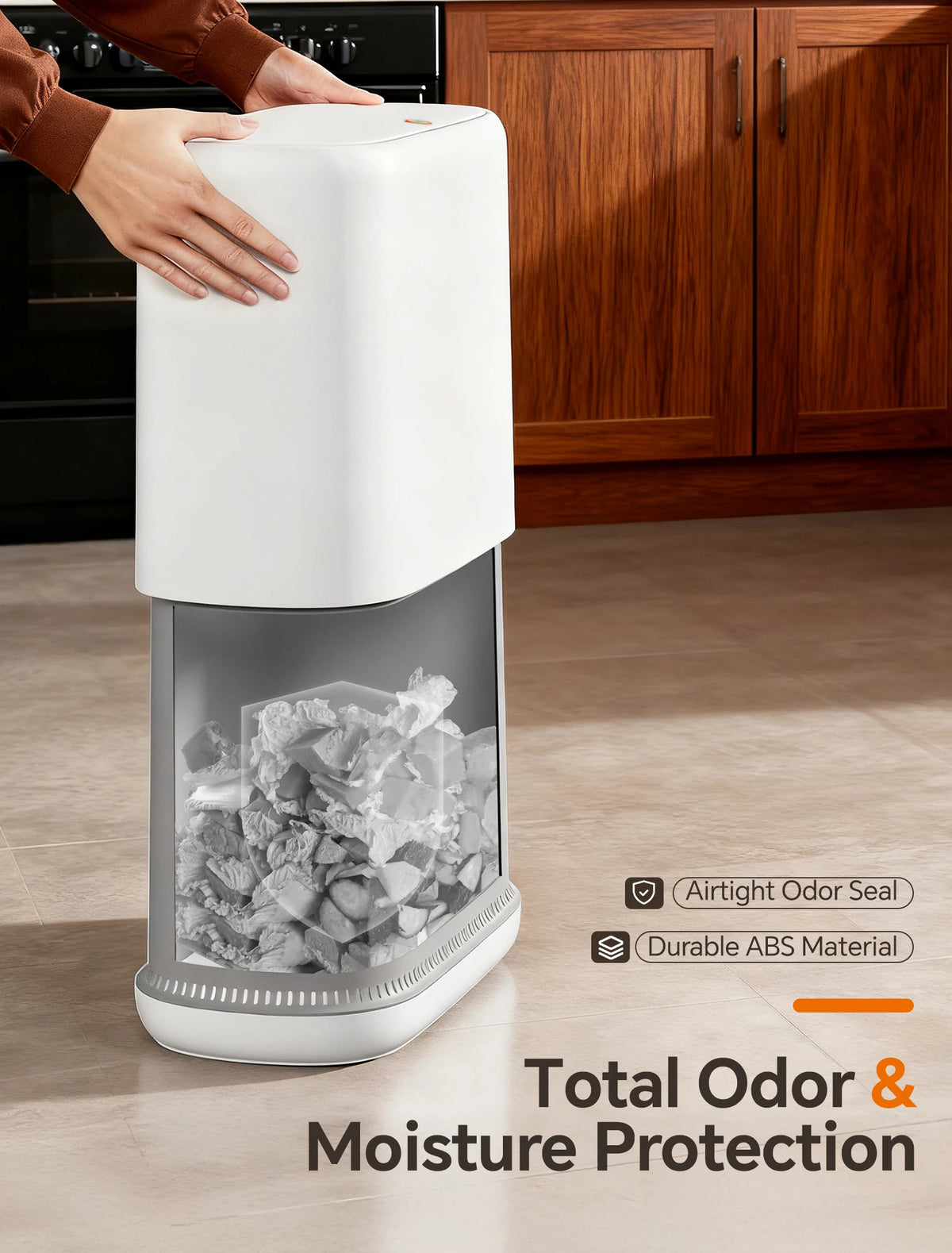 A white touchless trash can with a clear compartment showing dry ice and an airtight odor seal.