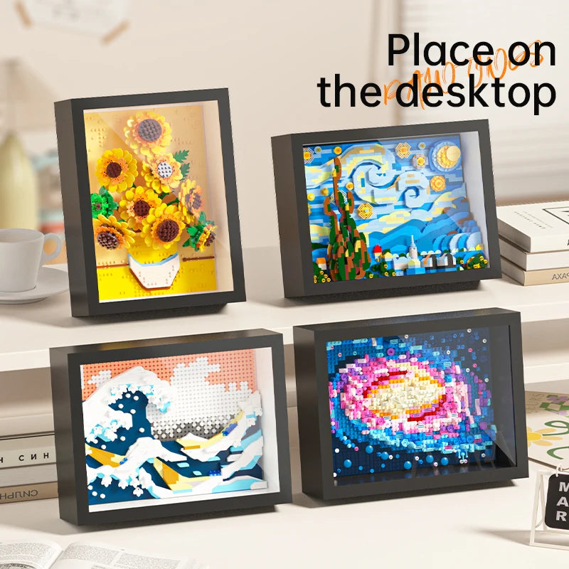 A display of four framed art pieces featuring Van Gogh and classic paintings on a white surface.