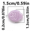 A light purple, handcrafted ceramic fish bead with a rounded body and subtle features.