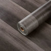 Roll of self-adhesive wood grain floor stickers in dark gray for peel-and-stick wallpaper