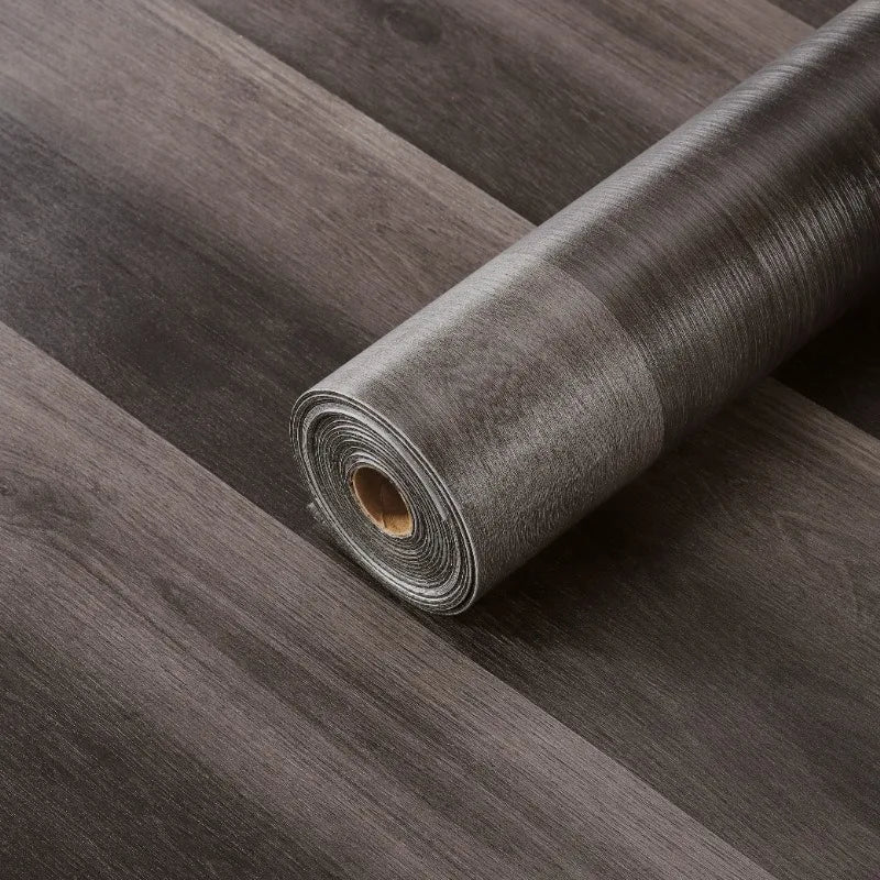 Roll of self-adhesive wood grain floor stickers in dark gray for peel-and-stick wallpaper