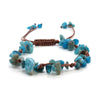 A close-up of braided crystal chip stone bracelets featuring blue and green natural quartz beads.