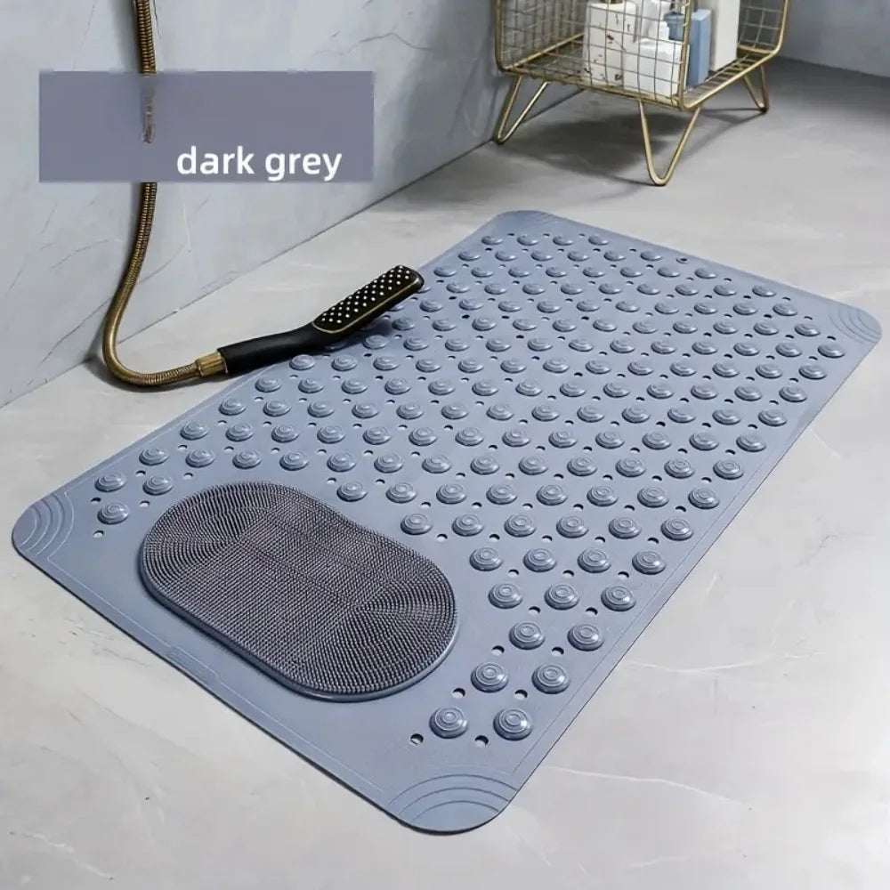 A dark grey non-slip suction cup bath mat with massage nodes placed on a light surface.