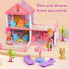 A pink dollhouse scene featuring a multi-story castle with interior furniture and exterior accessories.