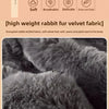Close-up of dark gray rabbit fur velvet fabric texture and pile.