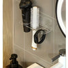 Wall-mounted acrylic organizer holding a hairbrush and comb on a white dispenser.