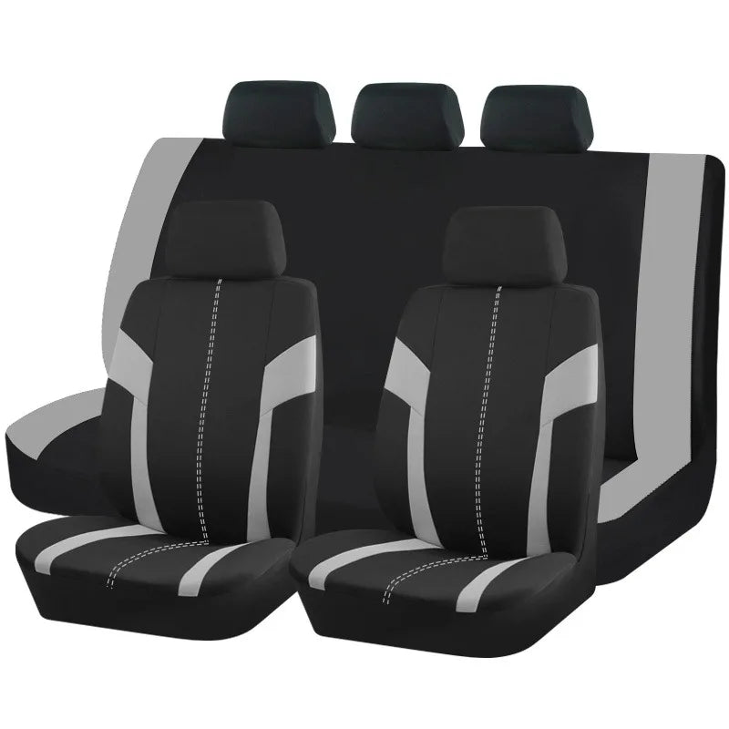 A set of nine black and gray car seat covers displayed in a row.