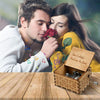 A couple tenderly shares a rose while a vintage hand-cranked wooden music box plays Can't Help Falling in Love.