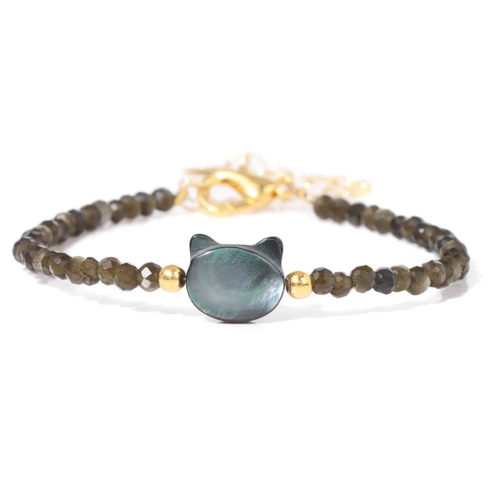 A natural stone bead bracelet featuring dark green and blue-gray stones with a silver-toned lace-up closure.