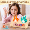 A young girl is playing with a wooden counting toy featuring number blocks and activity cards.