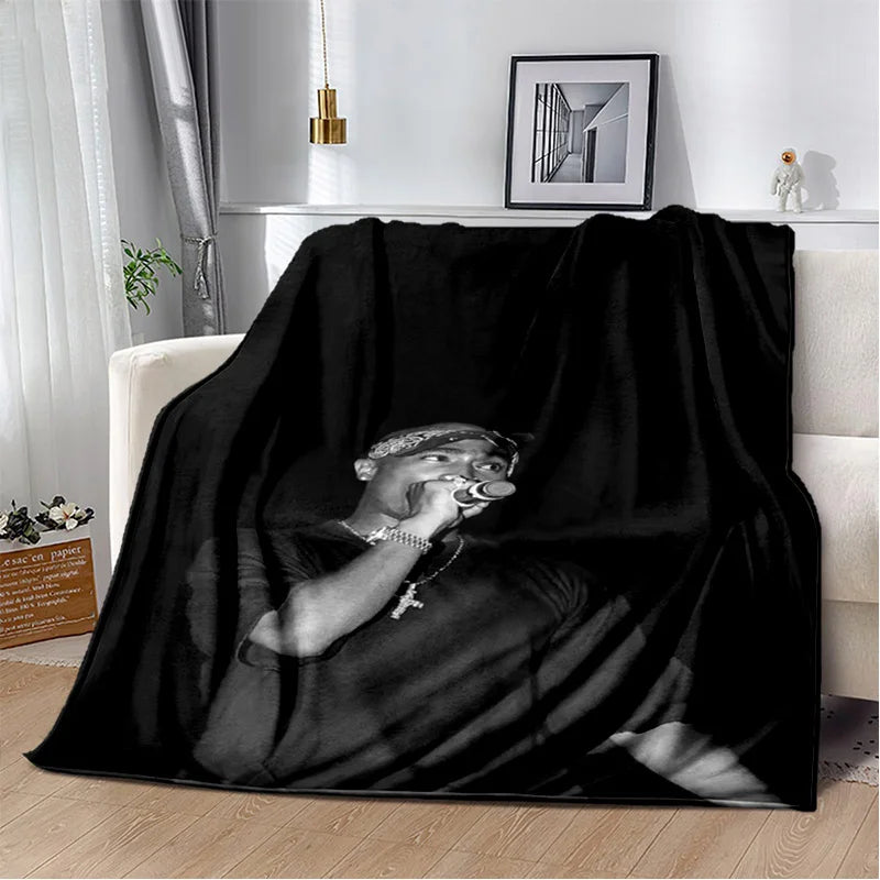 A black throw blanket featuring a portrait of Eminem and 2Pac in dramatic lighting.