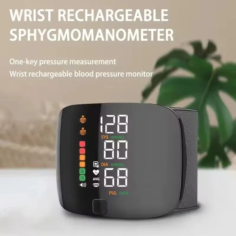 A black wrist rechargeable sphygmomanometer device displaying blood pressure readings and a green plant in the background.