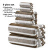 A stack of six brown and white striped bath towels, including washcloths and a hand towel.