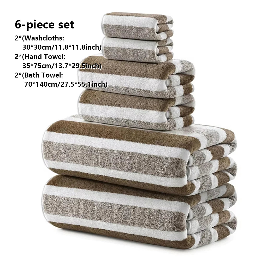 A stack of six brown and white striped bath towels, including washcloths and a hand towel.