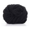 A ball of black chunky chenille yarn used for knitting and crochet
