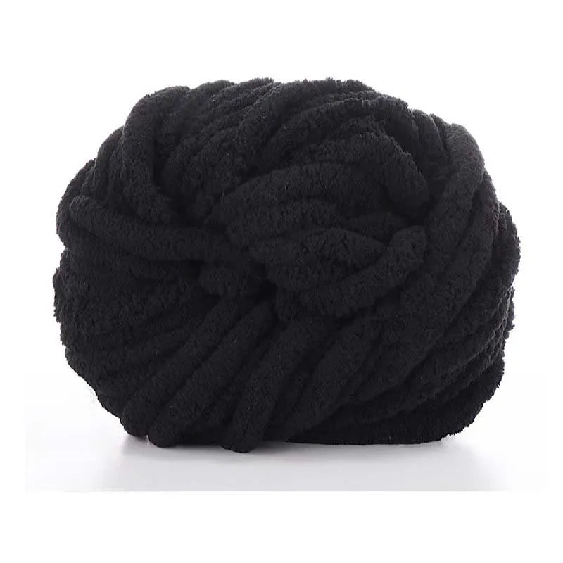 A ball of black chunky chenille yarn used for knitting and crochet