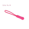 A pink plastic zipper pull is shown against a white background.