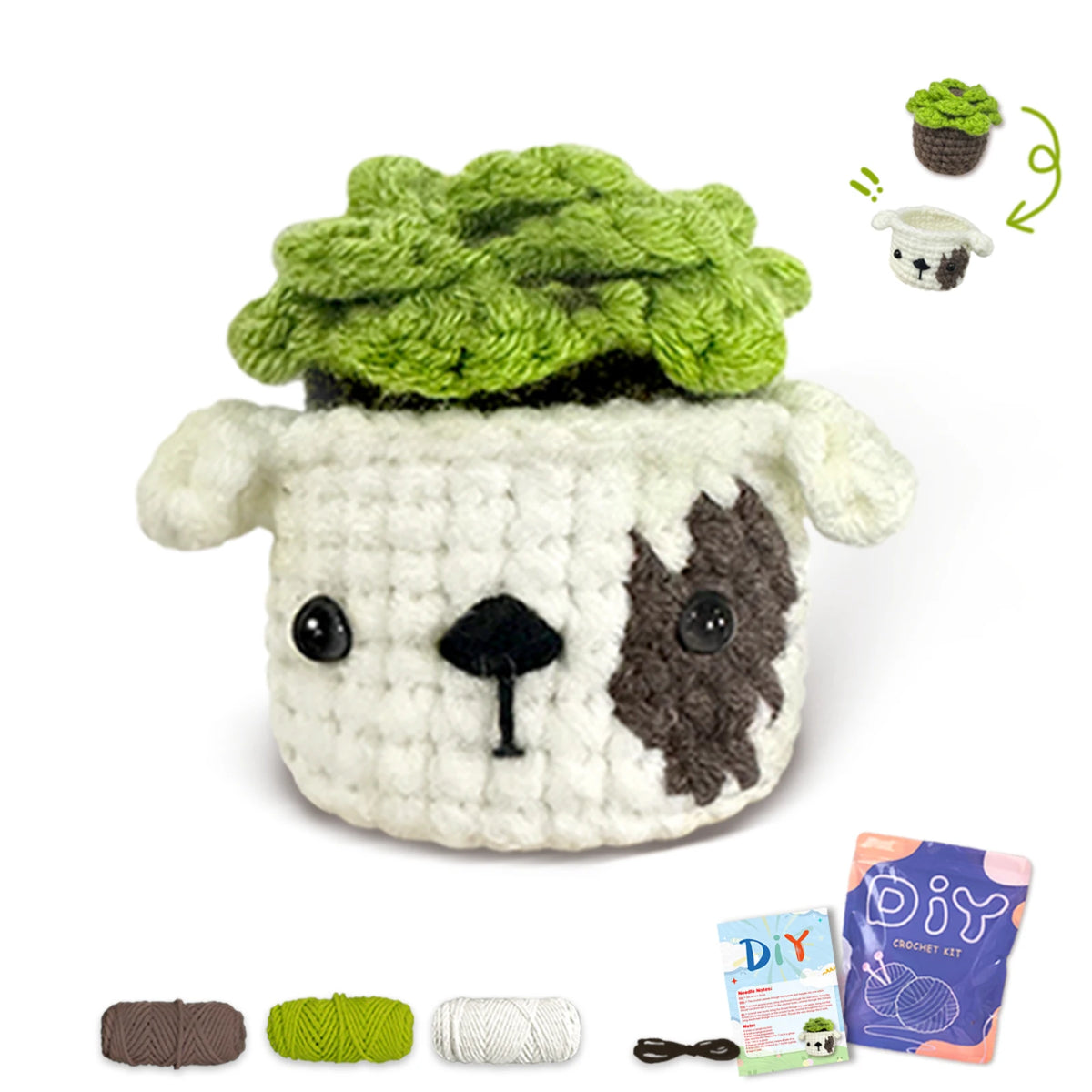 A finished crochet kit featuring a green textured animal, a small white animal, and yarn supplies.