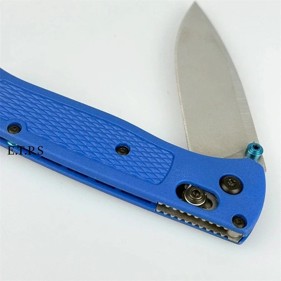 A blue folding pocket knife with a drop point blade is shown from the side.