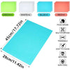 A set of four colored EVA refrigerator shelf liners including green, white, blue, and red mats, with a large cyan mat shown f