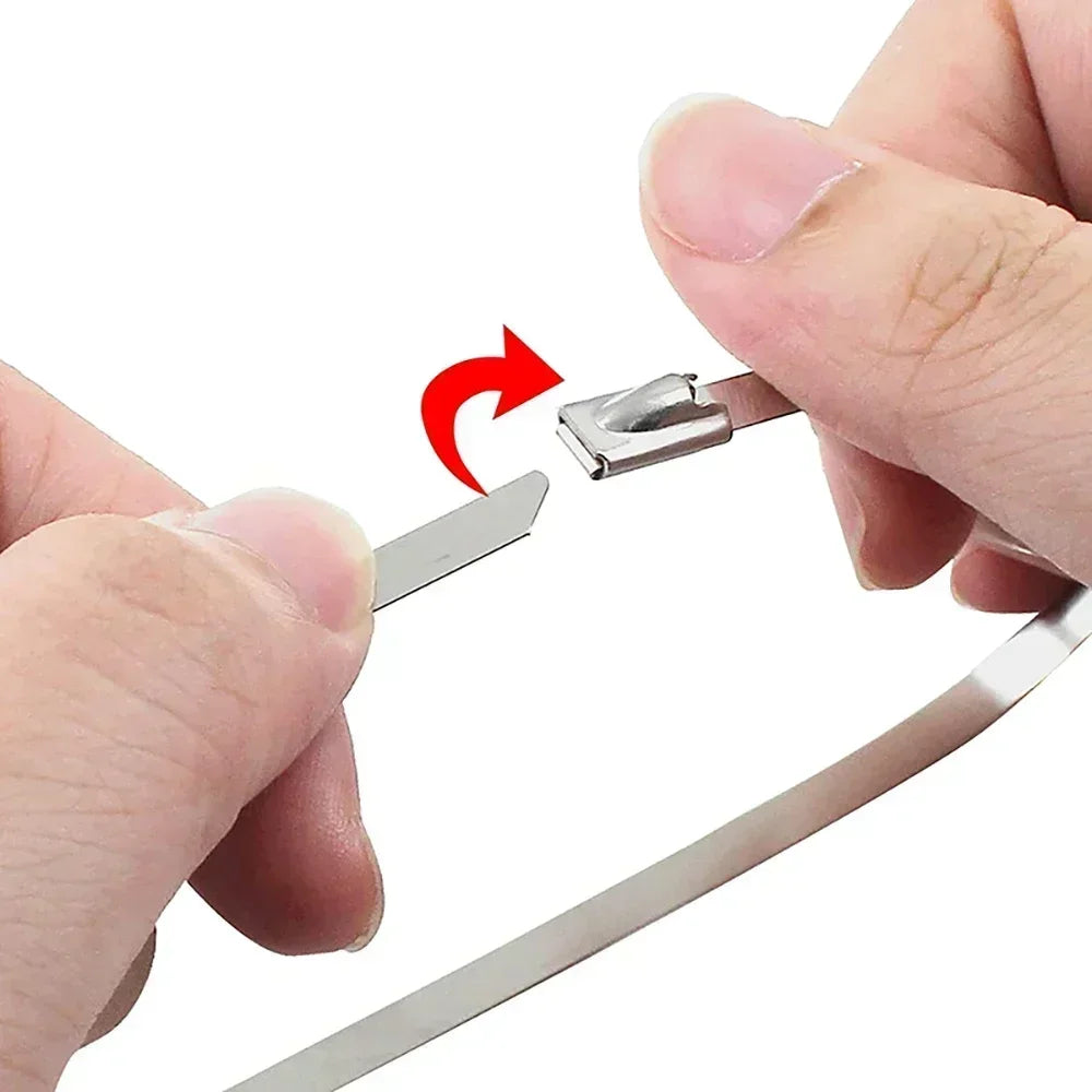 A hand is using pliers to tighten a heavy-duty stainless steel cable tie.