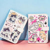 A pink and white cartoon cat leather passport holder featuring various cute cat illustrations.