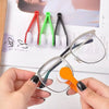 A hand holds a pair of eyeglasses, demonstrating a portable microfiber cleaning cloth with a brush and various colored cleani