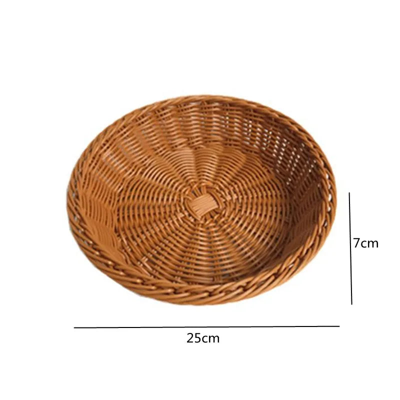 A round, handwoven wicker serving basket with a natural brown color and a diameter of 25cm.