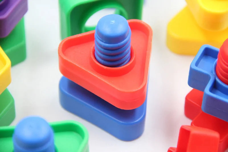 A close-up of colorful screw building blocks in various shapes and colors like red, blue, green, and yellow.