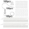 A collection of jewelry making components including lobster clasps, jump rings, and crimps.