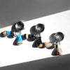 A set of three stainless steel bottomless espresso portafilters with wooden handles and AEX branding.